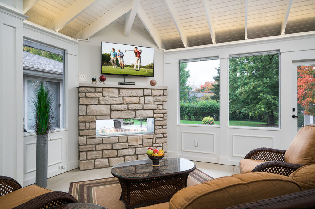 Outdoor Upper Arlington screened porch addition with television