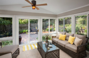 Outdoor sunroom with fan and garden