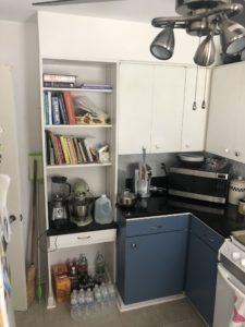 Kitchen with blue cabinet accents