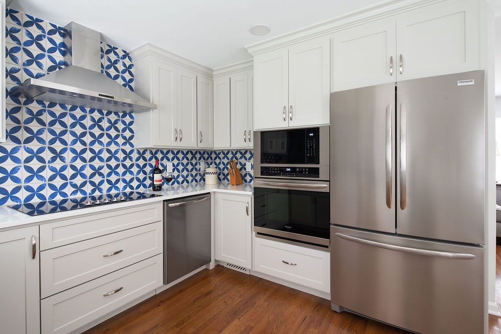 Kitchen renovation with blue and white backsplash