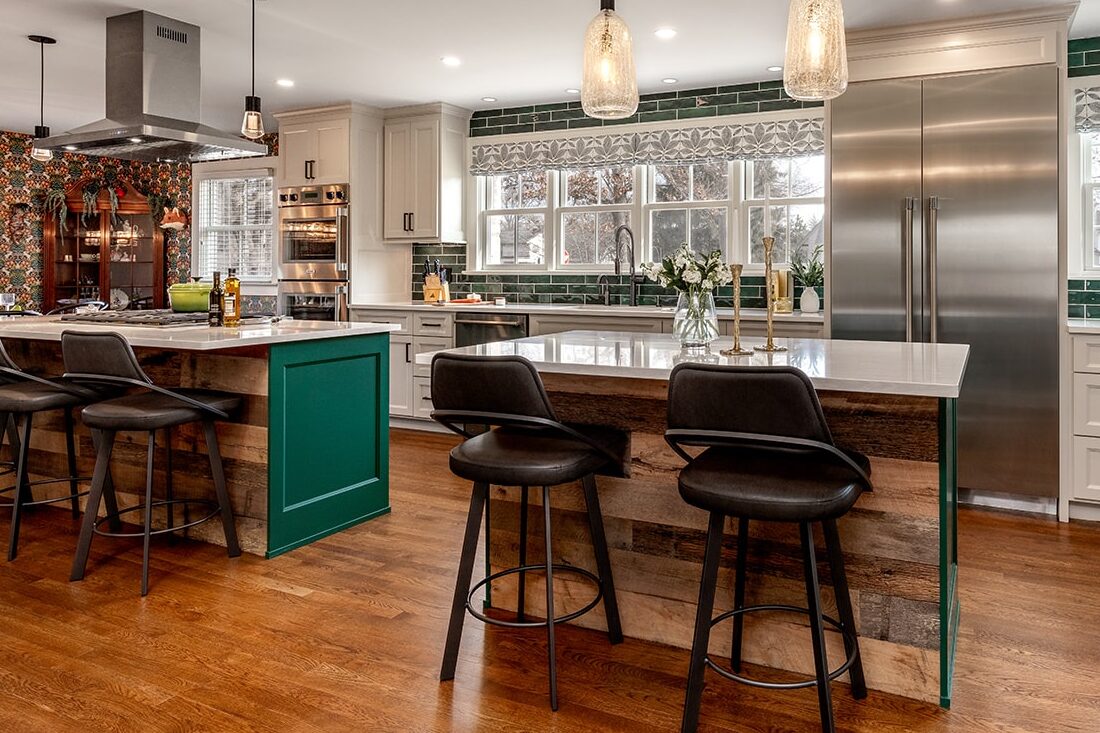 Kitchen remodel in Upper Arlington, OH features 2 islands with seating providing ample countertop space for preparing meals and entertaining.