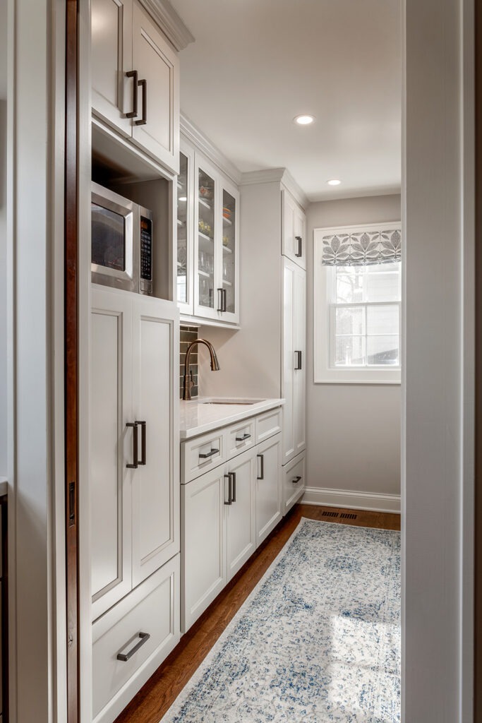 This kitchen pantry features a hidden "messy" kitchen that can be closed off with a pocket door.