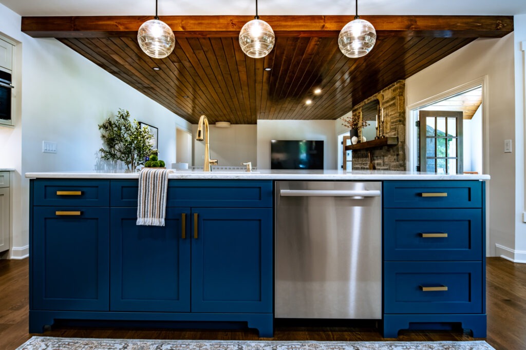 8.5' kitchen island painted Sherwin Williams SW 7620 Seaworthy with Cambria Ironsbridge countertop.